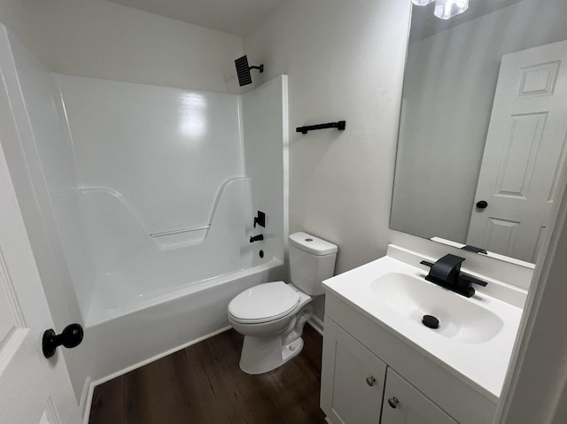 full bath featuring toilet, shower / tub combination, wood finished floors, and vanity