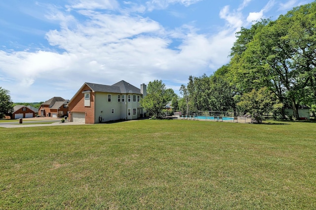 view of yard featuring an outdoor pool