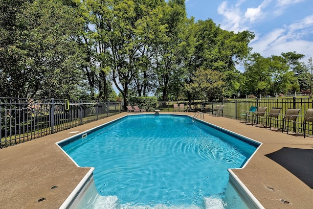 view of pool featuring a fenced in pool, a patio area, and fence