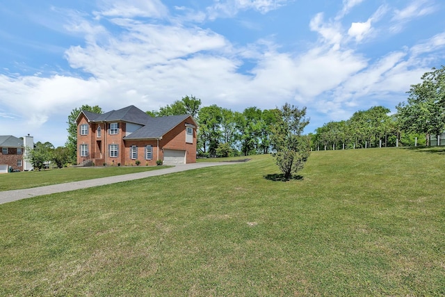 view of front of property with a garage, driveway, a front yard, and brick siding