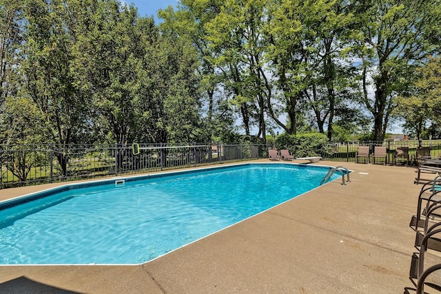 view of pool featuring a patio area, fence, and a fenced in pool