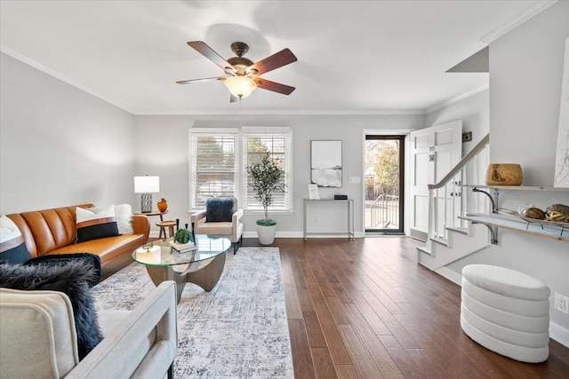 living room with dark wood-style floors, a healthy amount of sunlight, baseboards, and stairs