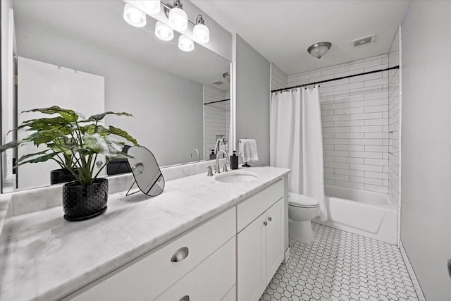 full bathroom with shower / bath combo, visible vents, vanity, and toilet