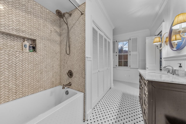 bathroom featuring a wainscoted wall, shower / bath combination, vanity, ornamental molding, and a closet