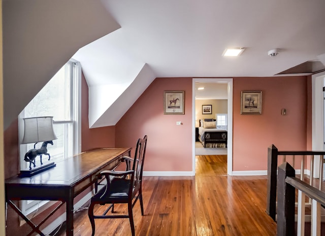 office with light wood-style flooring and baseboards