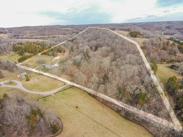 birds eye view of property with a rural view