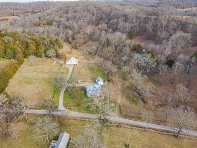 aerial view with a wooded view