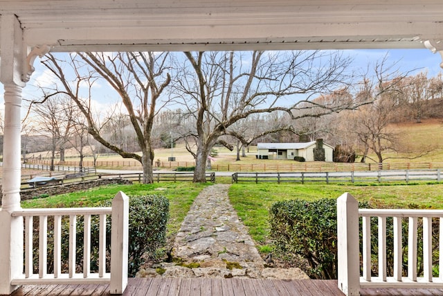 view of yard featuring a rural view and fence