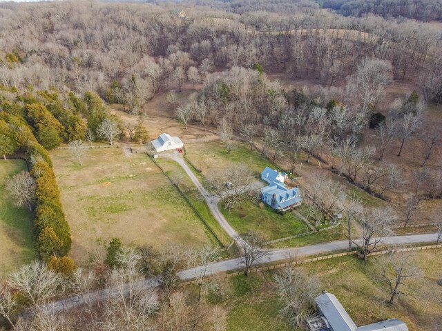 drone / aerial view with a view of trees