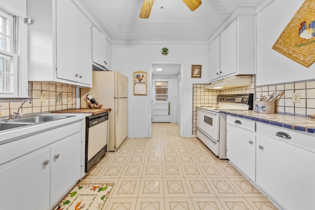 kitchen with backsplash, white cabinets, a sink, white appliances, and under cabinet range hood