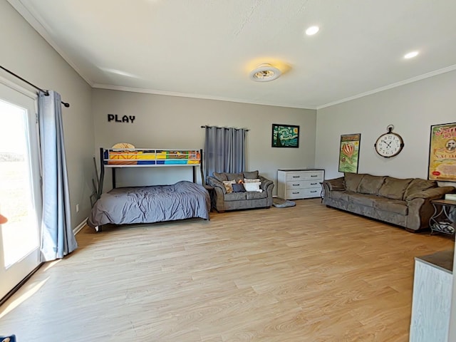 bedroom with ornamental molding, light wood-type flooring, and multiple windows