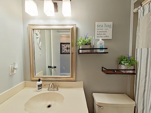 bathroom featuring toilet and a sink