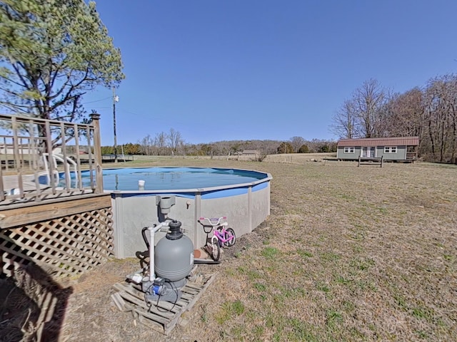 outdoor pool with a yard