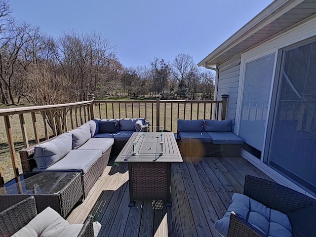 wooden terrace featuring an outdoor hangout area