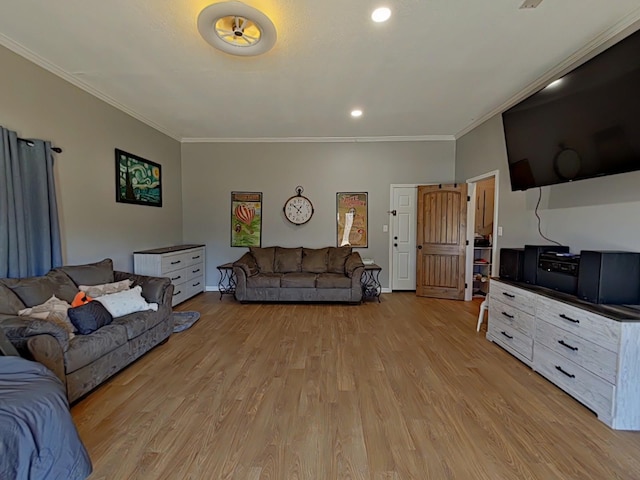 living area featuring ornamental molding, recessed lighting, light wood-style flooring, and baseboards