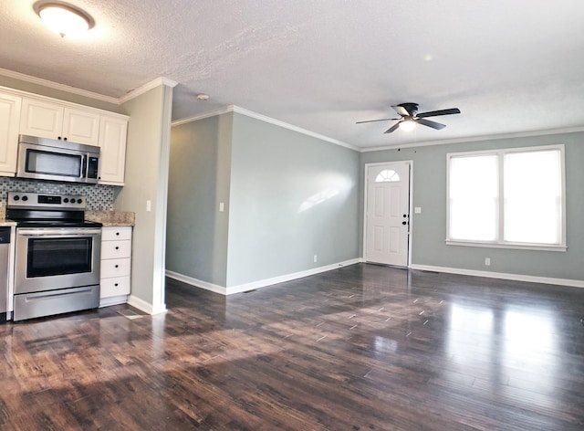 kitchen featuring stainless steel appliances, baseboards, tasteful backsplash, dark wood finished floors, and crown molding