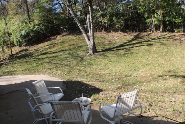 view of yard with fence and a patio