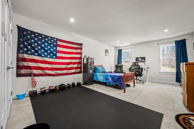 exercise room with recessed lighting, carpet flooring, visible vents, and baseboards