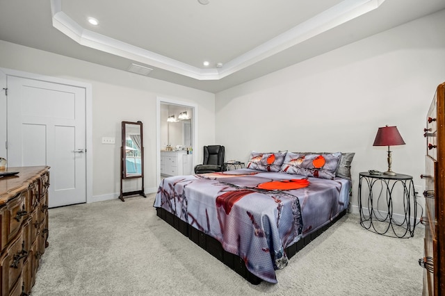 bedroom with baseboards, connected bathroom, carpet, a tray ceiling, and recessed lighting