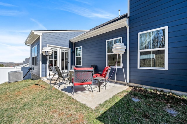 back of house with a yard, a patio area, fence, and central AC unit