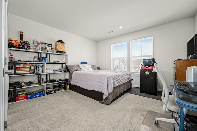 bedroom featuring carpet and visible vents