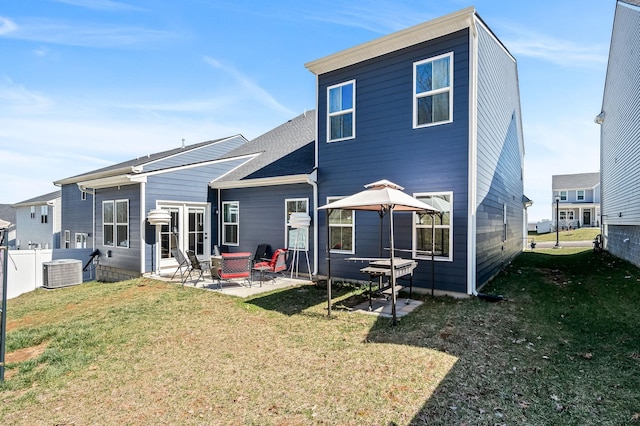 back of house featuring central air condition unit, a patio area, a gazebo, and a yard