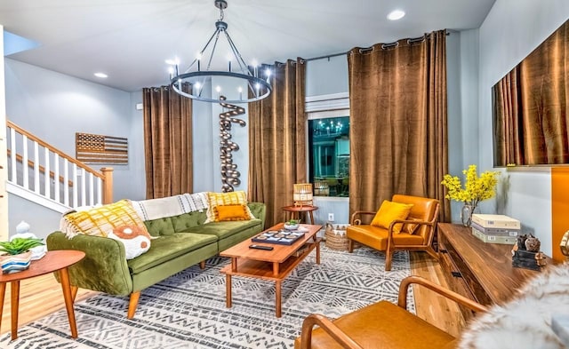 interior space with stairway, recessed lighting, wood finished floors, and an inviting chandelier