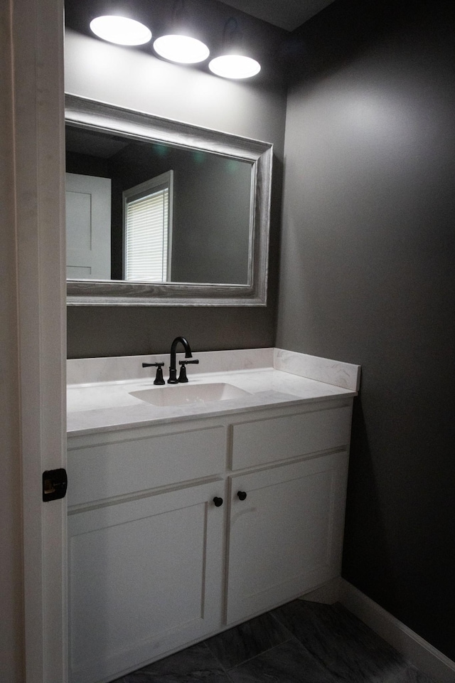 bathroom featuring vanity and baseboards