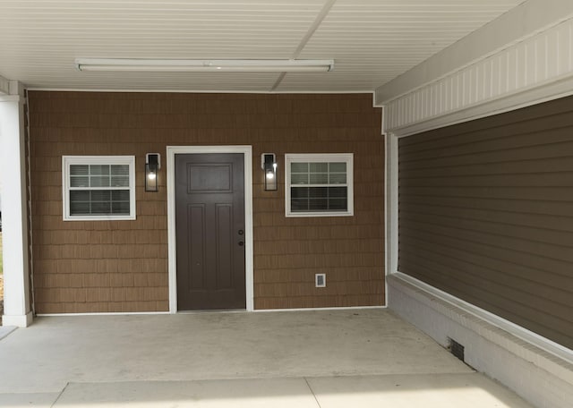 view of exterior entry with crawl space