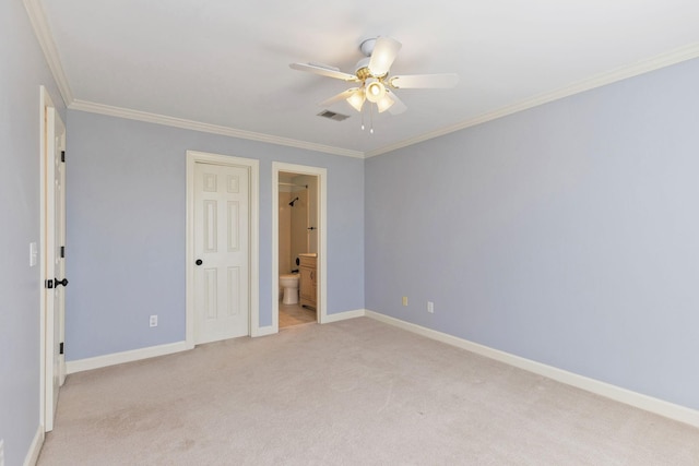 unfurnished bedroom featuring light carpet, baseboards, visible vents, ornamental molding, and ensuite bathroom