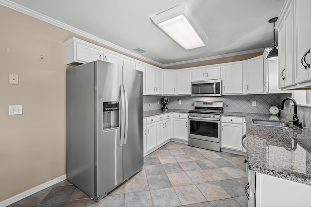 kitchen with stainless steel appliances, a sink, backsplash, and ornamental molding