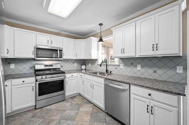 kitchen with white cabinets, backsplash, stainless steel appliances, and a sink