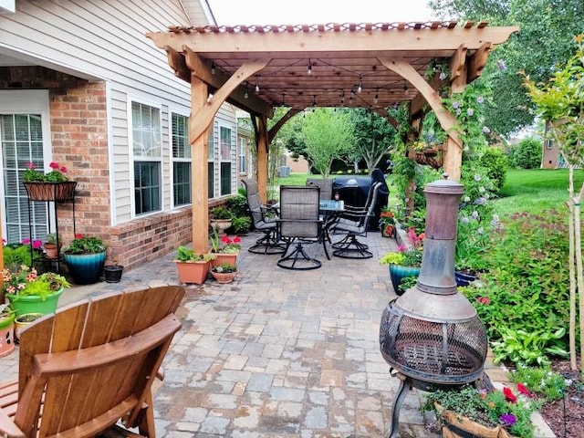 view of patio / terrace with outdoor dining space and a pergola