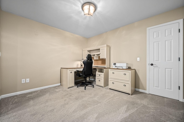 office area featuring light colored carpet and baseboards