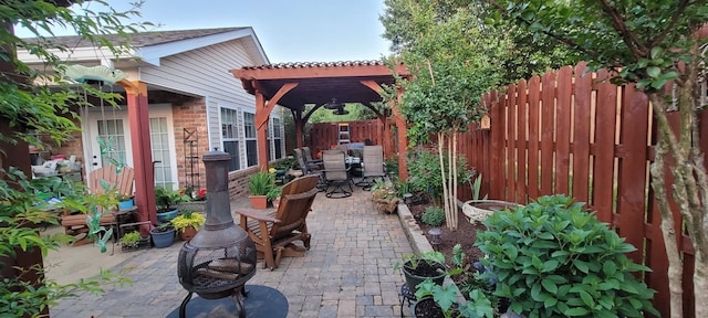 view of patio / terrace featuring a fenced backyard and a pergola