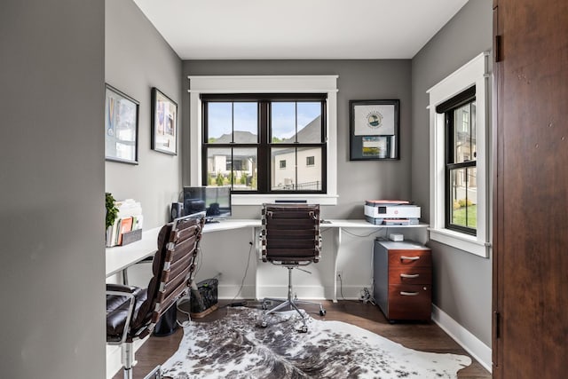 home office with wood finished floors and baseboards