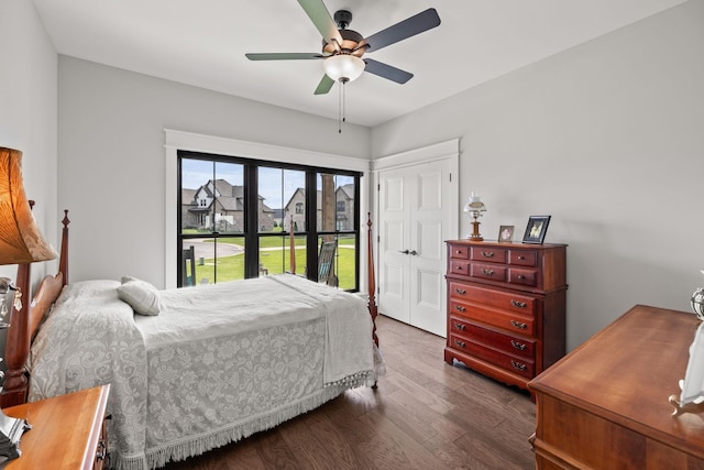 bedroom featuring a closet, a ceiling fan, and wood finished floors