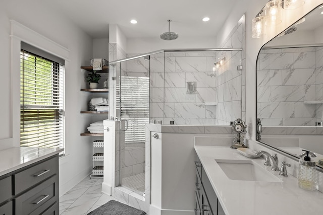 full bath with a stall shower, marble finish floor, vanity, and recessed lighting