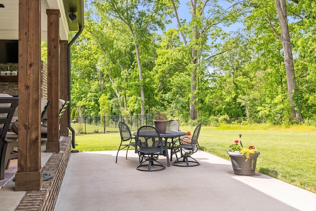 view of patio / terrace featuring outdoor dining area and fence