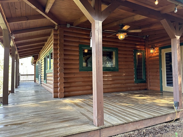 wooden deck featuring a ceiling fan