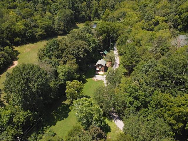 bird's eye view featuring a wooded view