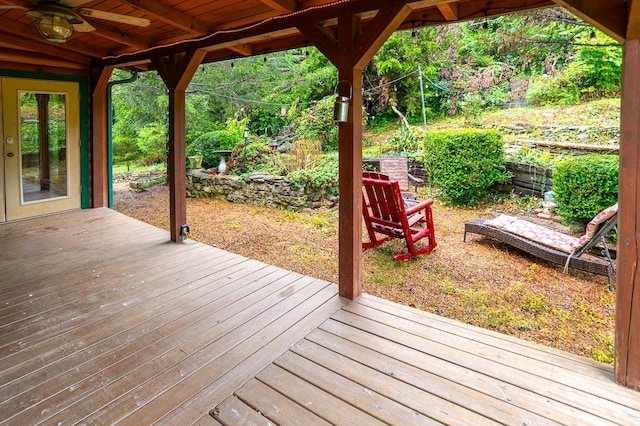 wooden deck featuring ceiling fan