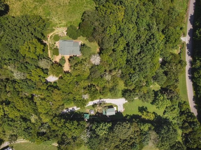 birds eye view of property featuring a view of trees