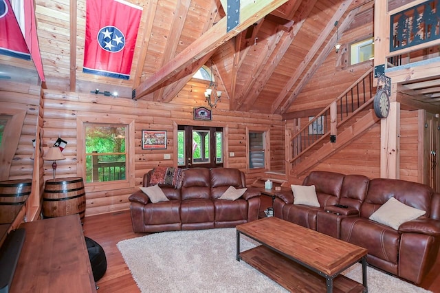 living room featuring wooden ceiling, wood finished floors, stairs, high vaulted ceiling, and beam ceiling