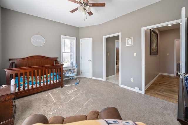 carpeted bedroom featuring ceiling fan and baseboards