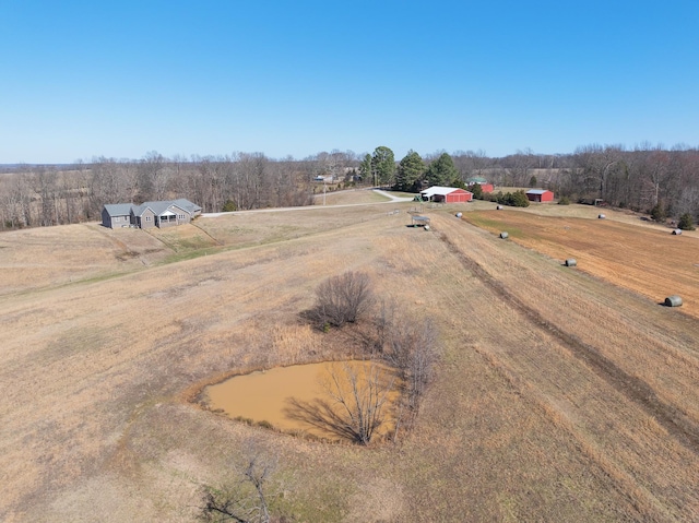 birds eye view of property with a rural view