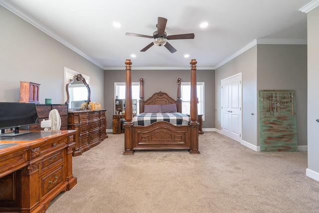 bedroom with ornamental molding, light colored carpet, and baseboards