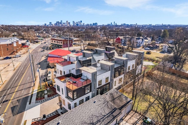 birds eye view of property with a view of city