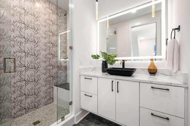 bathroom featuring a stall shower and vanity