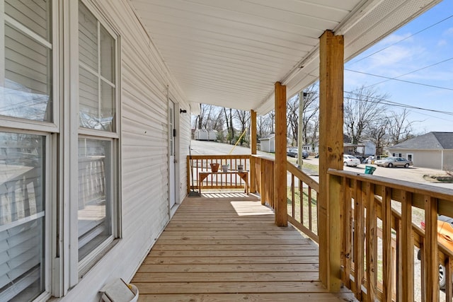 wooden deck featuring covered porch